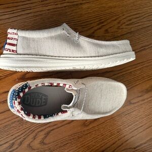 Hey Dude Cream Slip-Ons with Red and Blue Accents